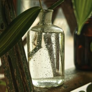 Natural oil in a glass bottle, photo by gryffyn m on Unsplash